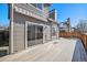 Back deck with awning and sliding glass doors leading to the interior at 2575 S Independence Ct, Lakewood, CO 80227