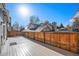 Spacious back deck with wood-like composite decking and a fenced yard at 2575 S Independence Ct, Lakewood, CO 80227