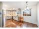 Modern kitchen with gray cabinets, granite countertops, and stainless steel appliances at 2575 S Independence Ct, Lakewood, CO 80227