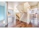 View of a carpeted staircase with hardwood floors on the landing at 2575 S Independence Ct, Lakewood, CO 80227