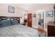 Comfortable bedroom with hardwood floors and ensuite bathroom at 2564 S Acoma St, Denver, CO 80223