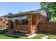 Charming brick home with a covered porch and neat landscaping, offering great curb appeal at 2564 S Acoma St, Denver, CO 80223