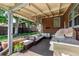Relaxing brick patio with comfortable seating, grill, and charming floral accents at 2564 S Acoma St, Denver, CO 80223