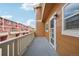 Spacious balcony with wood flooring and white railing overlooking the neighborhood at 18173 E Saskatoon Pl, Parker, CO 80134