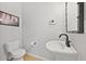 Chic half bathroom features stylish fixtures, a modern sink, and tile flooring at 18173 E Saskatoon Pl, Parker, CO 80134