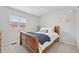 Bedroom with a wooden bed frame and a window with light coming in at 18173 E Saskatoon Pl, Parker, CO 80134