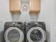 Laundry room with modern washer and dryer with tiled wall above them at 18173 E Saskatoon Pl, Parker, CO 80134