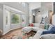 Bright living room featuring large windows, comfortable seating, and modern decor at 18173 E Saskatoon Pl, Parker, CO 80134