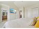 Bright bedroom features a TV and access to an en suite bathroom and laundry room at 18173 E Saskatoon Pl, Parker, CO 80134