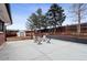 Large backyard with a cement patio, a basketball court, a shed, and a privacy fence at 7488 S Lafayette E Cir, Centennial, CO 80122