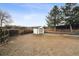 Large backyard featuring a shed, privacy fence and plenty of space for outdoor activities at 7488 S Lafayette E Cir, Centennial, CO 80122