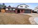 Charming two-story home features a brick exterior, arched entryway, and a well-maintained front yard at 7488 S Lafayette E Cir, Centennial, CO 80122