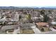 Aerial shot showcasing the neighborhood with mountain views and tree-lined streets at 1823 S Carr St, Lakewood, CO 80232