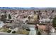 An aerial view reveals a charming home nestled in a peaceful neighborhood with mountain views at 1823 S Carr St, Lakewood, CO 80232