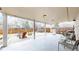 Large, covered back patio with outdoor seating and barbecue grill for relaxation and entertaining at 1823 S Carr St, Lakewood, CO 80232