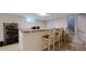 Basement bar with tile countertop, sink, and a wine rack at 1823 S Carr St, Lakewood, CO 80232