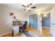 Bright bedroom featuring a ceiling fan, a closet, and hardwood floors at 1823 S Carr St, Lakewood, CO 80232