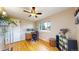 Comfortable office with hardwood floors, fan and a view from a large window at 1823 S Carr St, Lakewood, CO 80232