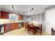 Cozy eat-in kitchen featuring track lighting, stainless steel appliances, and wooden cabinets at 1823 S Carr St, Lakewood, CO 80232