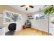 Bright office space with hardwood floors, large windows providing natural light, and a view of the outdoors at 1823 S Carr St, Lakewood, CO 80232
