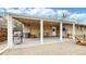 Outdoor patio boasts a built-in grill, string lights, and brick accents, perfect for entertaining guests at 1823 S Carr St, Lakewood, CO 80232