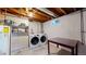 Spacious utility room with modern washer and dryer hookups and ample storage space at 1823 S Carr St, Lakewood, CO 80232