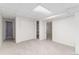 Finished basement with large closet, neutral carpet and white painted walls at 10836 W Evans Ave # 29, Lakewood, CO 80227