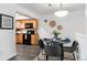 Cozy dining area with stylish decor and adjacent kitchen featuring updated appliances at 10836 W Evans Ave # 29, Lakewood, CO 80227
