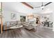 Open-concept living area boasts hardwood floors, vaulted ceilings, and a cozy fireplace at 10836 W Evans Ave # 29, Lakewood, CO 80227