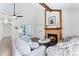 Comfortable living room features a tiled fireplace, neutral decor, and hardwood flooring at 10836 W Evans Ave # 29, Lakewood, CO 80227
