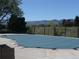 Swimming pool with cover and mountain views in the distance at 10836 W Evans Ave # 29, Lakewood, CO 80227