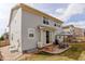 Home's backyard boasts a charming patio for outdoor dining and a well-maintained lawn at 2033 E 167Th Way, Thornton, CO 80602