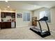 Basement featuring a workout area with a treadmill and a wet bar, enhancing leisure and fitness options at 2033 E 167Th Way, Thornton, CO 80602