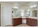 Bathroom with double sinks, vanity, and large mirrors at 2033 E 167Th Way, Thornton, CO 80602
