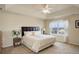 Bedroom with a bed, dresser, bedside tables, and a bright window at 2033 E 167Th Way, Thornton, CO 80602