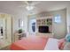 Bright bedroom with built-in dresser and media center and a desk at 2033 E 167Th Way, Thornton, CO 80602