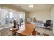 Inviting bonus room filled with natural light, perfect for hobbies or relaxing with a ceiling fan overhead at 2033 E 167Th Way, Thornton, CO 80602