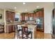 Kitchen island featuring a granite countertop and seating for two at 2033 E 167Th Way, Thornton, CO 80602
