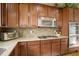 Spacious kitchen with granite countertops, stainless steel appliances and cherry cabinets at 2033 E 167Th Way, Thornton, CO 80602