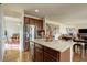 Kitchen features a center island, stainless steel appliances and granite countertops at 2033 E 167Th Way, Thornton, CO 80602