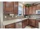 Gourmet kitchen with granite countertops, stainless steel appliances and cherry cabinets at 2033 E 167Th Way, Thornton, CO 80602