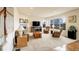 Spacious living room with large windows, a fireplace, and comfortable seating at 2033 E 167Th Way, Thornton, CO 80602