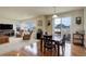 Bright living room with a dining area and sliding doors to the patio at 2033 E 167Th Way, Thornton, CO 80602