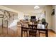 Open concept living room and dining area with a staircase and fireplace at 2033 E 167Th Way, Thornton, CO 80602