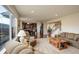 Bright and open living room with hardwood floors, a cozy sofa, and lots of natural light at 2033 E 167Th Way, Thornton, CO 80602
