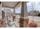 Inviting front porch with rocking chairs and stone pillars, perfect for relaxing outdoors at 2033 E 167Th Way, Thornton, CO 80602