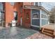 Cozy backyard patio featuring a stainless steel grill and classic brick home architecture at 131 N Sherman St, Denver, CO 80203