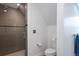 Modern bathroom featuring a glass-enclosed shower with gray tiling and modern fixtures at 131 N Sherman St, Denver, CO 80203