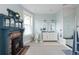 Bright bathroom with black and white tile, custom cabinetry, and a fireplace at 131 N Sherman St, Denver, CO 80203