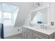 Bathroom features a double vanity, a large framed mirror and a window that provides plenty of natural light at 131 N Sherman St, Denver, CO 80203